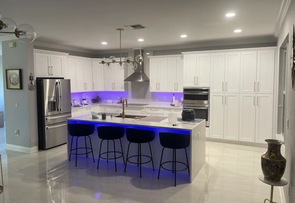 Modern White Kitchen with Ambient Lighting by Argon Construction