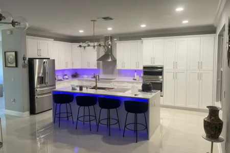 Modern White Kitchen with Ambient Lighting by Argon Construction